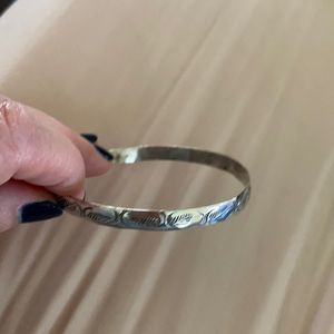 Silver bangle with design